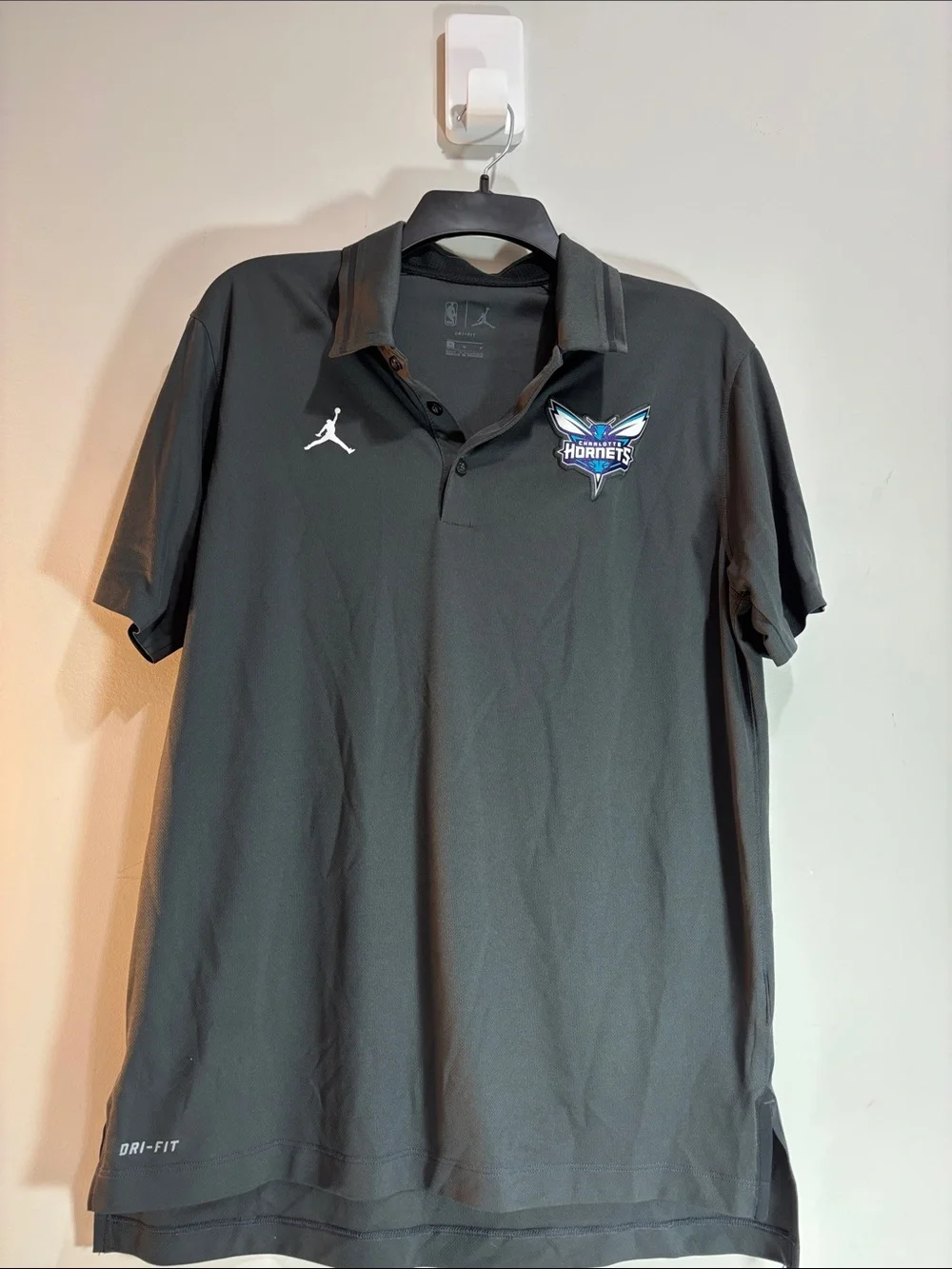Jordan Black Charlotte Hornets Polo with White Jumpman. 0189